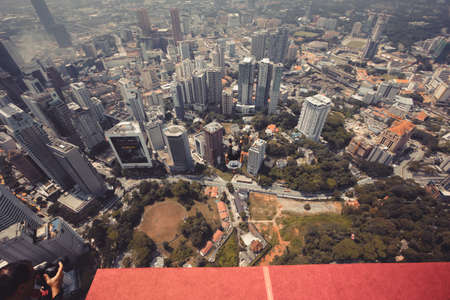 Kuala Lumpur, Malaysia â September 28, 2018: Base Jumpers jump from a 300m high deck during the Kuala Lumpur Tower International Jump.のeditorial素材