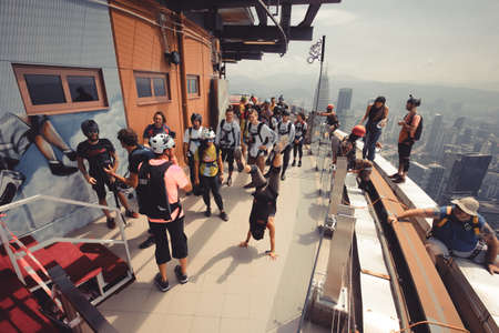 Kuala Lumpur, Malaysia â September 28, 2018: Base Jumpers jump from a 300m high deck during the Kuala Lumpur Tower International Jump.のeditorial素材
