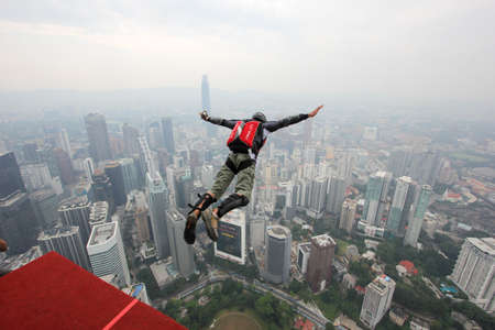Kuala Lumpur, Malaysia â€“ September 29, 2018: Base Jumpers jump from a 300m high deck during...