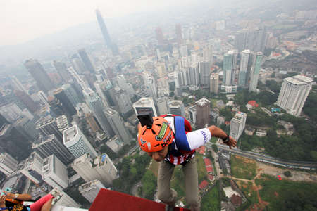 Kuala Lumpur, Malaysia â€“ September 29, 2018: Base Jumpers jump from a 300m high deck during...
