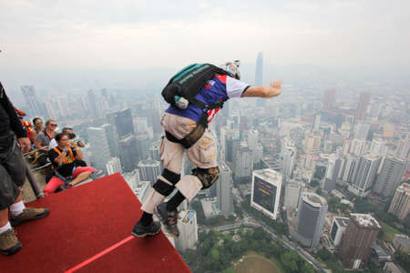 Kuala Lumpur, Malaysia â September 29, 2018: Base Jumpers jump from a 300m high deck during the Kuala Lumpur Tower International Jump.のeditorial素材