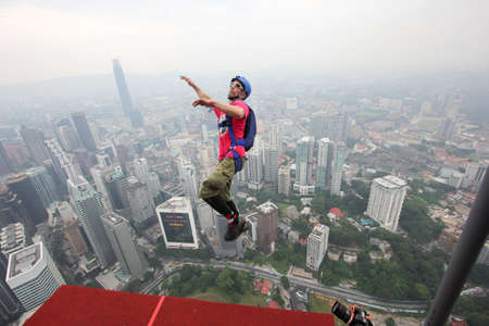Kuala Lumpur, Malaysia â September 29, 2018: Base Jumpers jump from a 300m high deck during the Kuala Lumpur Tower International Jump.のeditorial素材