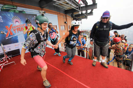 Kuala Lumpur, Malaysia â September 29, 2018: Base Jumpers jump from a 300m high deck during the Kuala Lumpur Tower International Jump.のeditorial素材