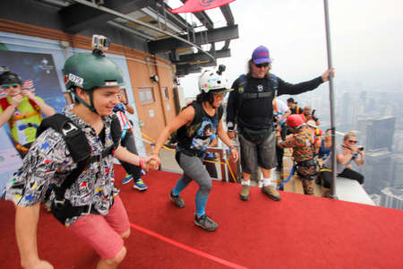 Kuala Lumpur, Malaysia â September 29, 2018: Base Jumpers jump from a 300m high deck during the Kuala Lumpur Tower International Jump.のeditorial素材