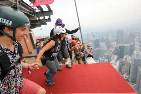 Kuala Lumpur, Malaysia â September 29, 2018: Base Jumpers jump from a 300m high deck during the Kuala Lumpur Tower International Jump.のeditorial素材