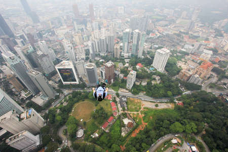Kuala Lumpur, Malaysia â September 29, 2018: Base Jumpers jump from a 300m high deck during the Kuala Lumpur Tower International Jump.のeditorial素材