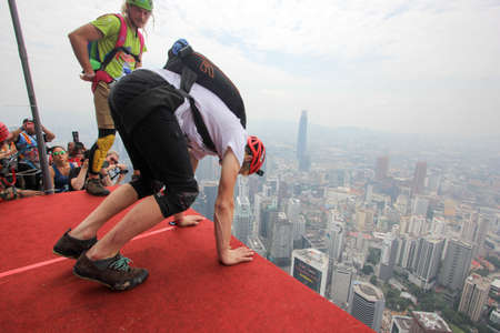 Kuala Lumpur, Malaysia â€“ September 29, 2018: Base Jumpers jump from a 300m high deck during...