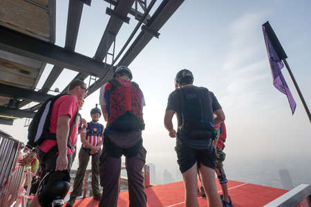 Kuala Lumpur, Malaysia  September 29, 2018: Base Jumpers jump from a 300m high deck during the Kuala Lumpur Tower International Jump.のeditorial素材