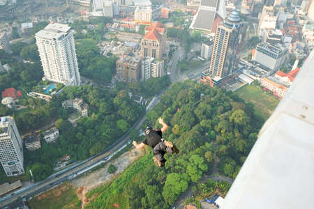 Kuala Lumpur, Malaysia â€“ September 29, 2018: Base Jumpers jump from a 300m high deck during...
