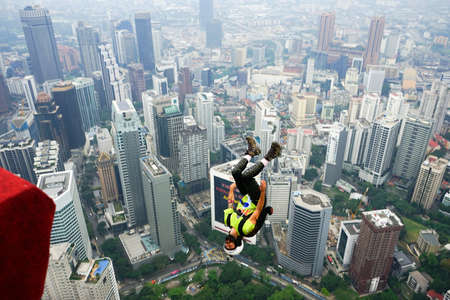 Kuala Lumpur, Malaysia â September 29, 2018: Base Jumpers jump from a 300m high deck during the Kuala Lumpur Tower International Jump.のeditorial素材