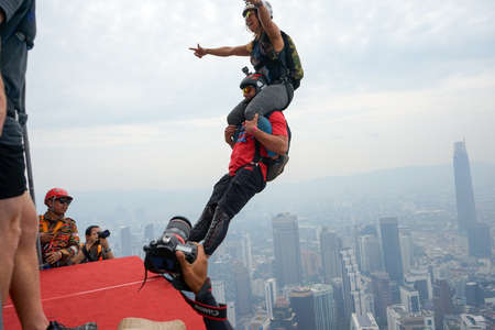 Kuala Lumpur, Malaysia  September 29, 2018: Base Jumpers jump from a 300m high deck during the Kuala Lumpur Tower International Jump.のeditorial素材