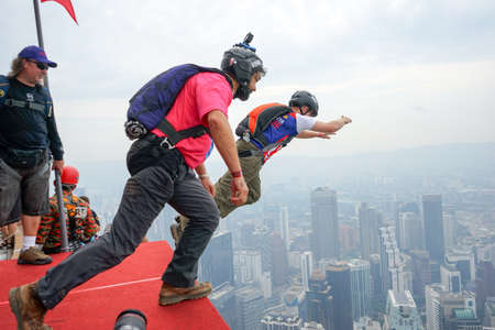 Kuala Lumpur, Malaysia â September 29, 2018: Base Jumpers jump from a 300m high deck during the Kuala Lumpur Tower International Jump.のeditorial素材