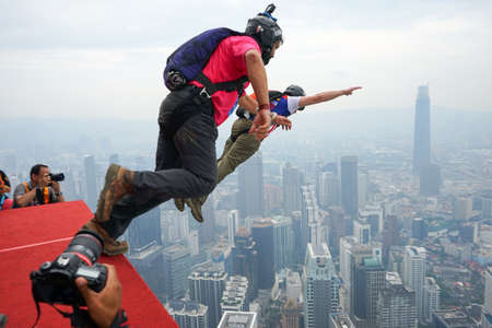Kuala Lumpur, Malaysia â September 29, 2018: Base Jumpers jump from a 300m high deck during the Kuala Lumpur Tower International Jump.のeditorial素材