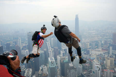 Kuala Lumpur, Malaysia â September 29, 2018: Base Jumpers jump from a 300m high deck during the Kuala Lumpur Tower International Jump.のeditorial素材