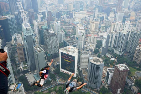 Kuala Lumpur, Malaysia â September 29, 2018: Base Jumpers jump from a 300m high deck during the Kuala Lumpur Tower International Jump.のeditorial素材