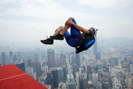Kuala Lumpur, Malaysia â September 29, 2018: Base Jumpers jump from a 300m high deck during the Kuala Lumpur Tower International Jump.のeditorial素材