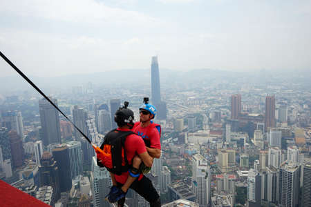 Kuala Lumpur, Malaysia â September 29, 2018: Base Jumpers jump from a 300m high deck during the Kuala Lumpur Tower International Jump.のeditorial素材