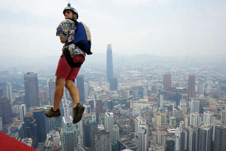 Kuala Lumpur, Malaysia â September 29, 2018: Base Jumpers jump from a 300m high deck during the Kuala Lumpur Tower International Jump.のeditorial素材