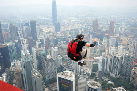 Kuala Lumpur, Malaysia â September 29, 2018: Base Jumpers jump from a 300m high deck during the Kuala Lumpur Tower International Jump.のeditorial素材