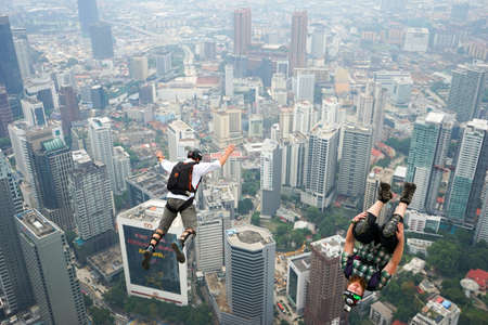 Kuala Lumpur, Malaysia â September 29, 2018: Base Jumpers jump from a 300m high deck during the Kuala Lumpur Tower International Jump.のeditorial素材