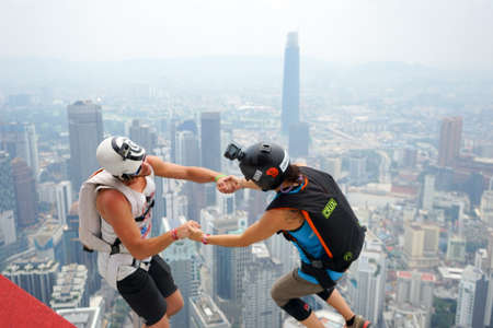 Kuala Lumpur, Malaysia â€“ September 29, 2018: Base Jumpers jump from a 300m high deck during...