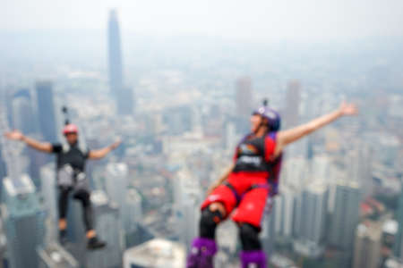 Kuala Lumpur, Malaysia â September 29, 2018: Base Jumpers jump from a 300m high deck during the Kuala Lumpur Tower International Jump.のeditorial素材