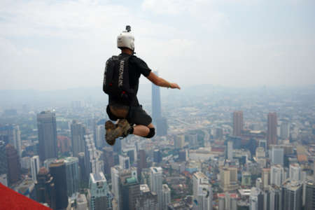 Kuala Lumpur, Malaysia â September 29, 2018: Base Jumpers jump from a 300m high deck during the Kuala Lumpur Tower International Jump.のeditorial素材