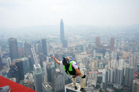 Kuala Lumpur, Malaysia â September 29, 2018: Base Jumpers jump from a 300m high deck during the Kuala Lumpur Tower International Jump.のeditorial素材