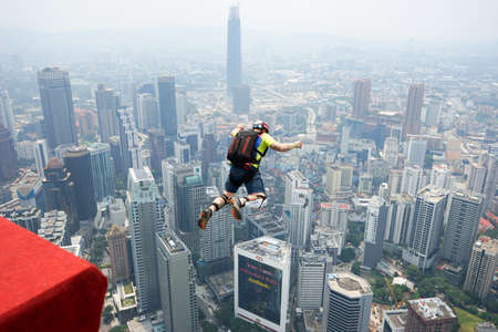 Kuala Lumpur, Malaysia â September 29, 2018: Base Jumpers jump from a 300m high deck during the Kuala Lumpur Tower International Jump.のeditorial素材