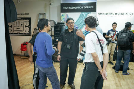 Kuala Lumpur, Malaysia â November 3, 2018: Group of photographers learning creative portrait during photo shooting in photography studio.のeditorial素材