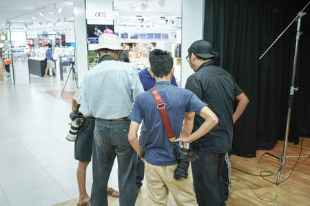 Kuala Lumpur, Malaysia â November 3, 2018: Group of photographers learning creative portrait during photo shooting in photography studio.のeditorial素材