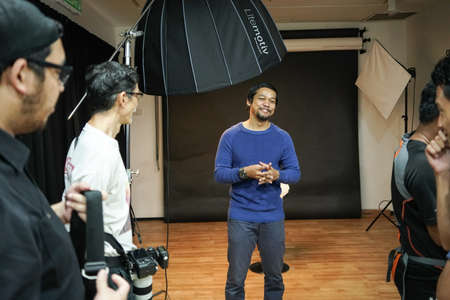 Kuala Lumpur, Malaysia â November 3, 2018: Group of photographers learning creative portrait during photo shooting in photography studio.のeditorial素材