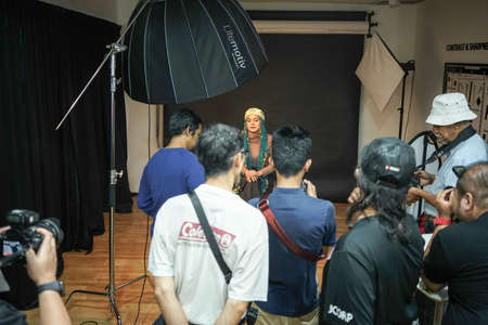 Kuala Lumpur, Malaysia â€“ November 3, 2018: Group of photographers learning creative portrait...