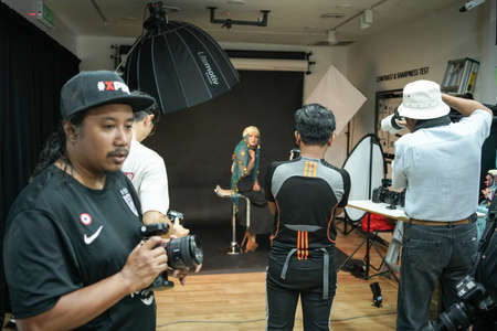 Kuala Lumpur, Malaysia â November 3, 2018: Group of photographers learning creative portrait during photo shooting in photography studio.のeditorial素材