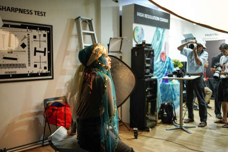 Kuala Lumpur, Malaysia â€“ November 3, 2018: Group of photographers learning creative portrait...