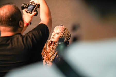 Kuala Lumpur, Malaysia â November 3, 2018: Group of photographers learning creative portrait during photo shooting in photography studio.のeditorial素材
