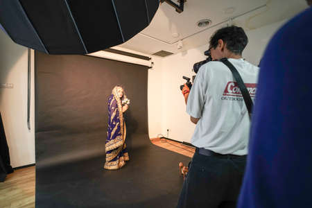 Kuala Lumpur, Malaysia â November 3, 2018: Group of photographers learning creative portrait during photo shooting in photography studio.のeditorial素材