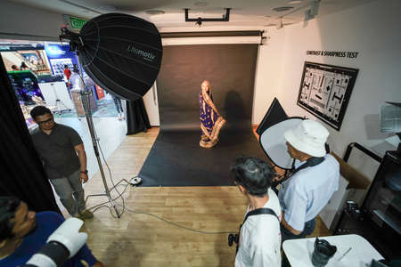 Kuala Lumpur, Malaysia â November 3, 2018: Group of photographers learning creative portrait during photo shooting in photography studio.のeditorial素材