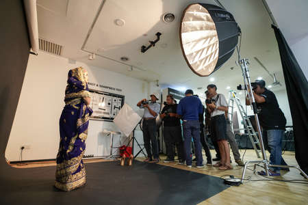 Kuala Lumpur, Malaysia â November 3, 2018: Group of photographers learning creative portrait during photo shooting in photography studio.のeditorial素材