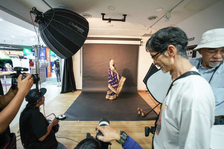 Kuala Lumpur, Malaysia â November 3, 2018: Group of photographers learning creative portrait during photo shooting in photography studio.のeditorial素材