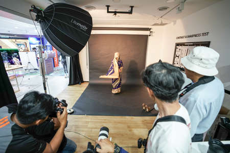 Kuala Lumpur, Malaysia â November 3, 2018: Group of photographers learning creative portrait during photo shooting in photography studio.のeditorial素材