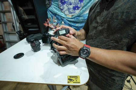 Kuala Lumpur, Malaysia â November 3, 2018: Group of photographers learning creative portrait during photo shooting in photography studio.のeditorial素材