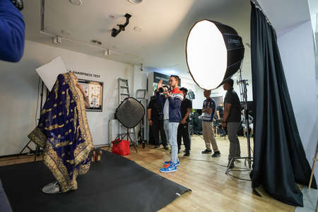 Kuala Lumpur, Malaysia â November 3, 2018: Group of photographers learning creative portrait during photo shooting in photography studio.のeditorial素材