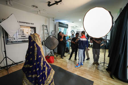 Kuala Lumpur, Malaysia â November 3, 2018: Group of photographers learning creative portrait during photo shooting in photography studio.のeditorial素材