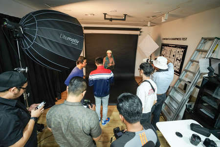 Kuala Lumpur, Malaysia â November 3, 2018: Group of photographers learning creative portrait during photo shooting in photography studio.のeditorial素材