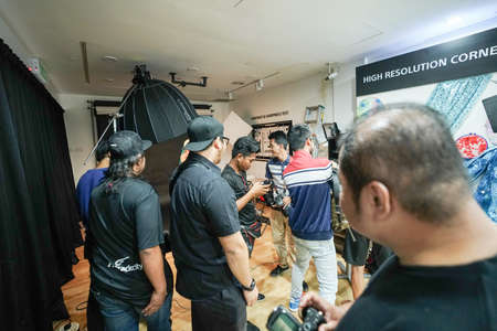 Kuala Lumpur, Malaysia â November 3, 2018: Group of photographers learning creative portrait during photo shooting in photography studio.のeditorial素材