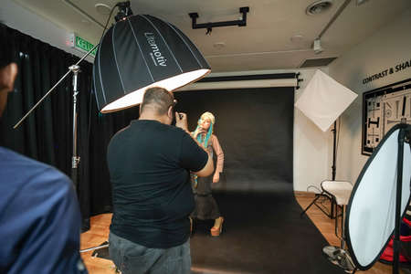 Kuala Lumpur, Malaysia â November 3, 2018: Group of photographers learning creative portrait during photo shooting in photography studio.のeditorial素材