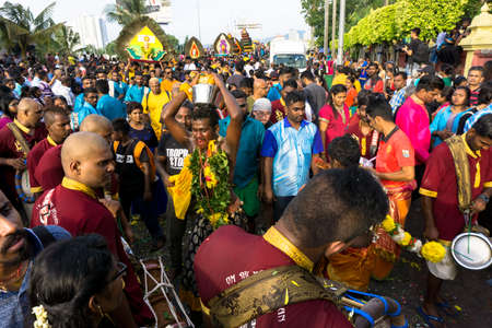 BATU CAVES, MALAYSIA - January 21, 2019: A celebration and devotee carrying kavadi preparing for ceremony prayers blessings during Thaipusam festival.のeditorial素材