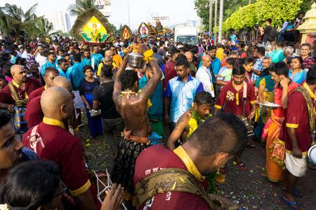 BATU CAVES, MALAYSIA - January 21, 2019: A celebration and devotee carrying kavadi preparing for ceremony prayers blessings during Thaipusam festival.のeditorial素材