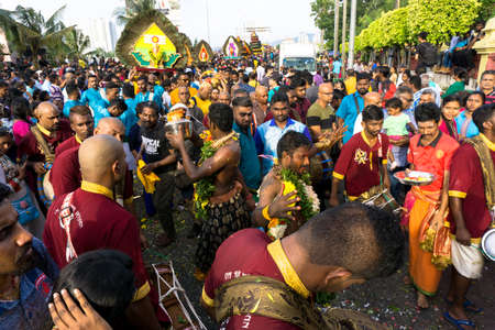 BATU CAVES, MALAYSIA - January 21, 2019: A celebration and devotee carrying kavadi preparing for ceremony prayers blessings during Thaipusam festival.のeditorial素材